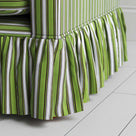 Close-up of handmade cotton ruffle skirt on Curtain Call loveseat by Nix Nicola Harding