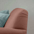 Curtain Call Love Seat close-up detail of the rounded backrest corner in laidback linen sweet briar.