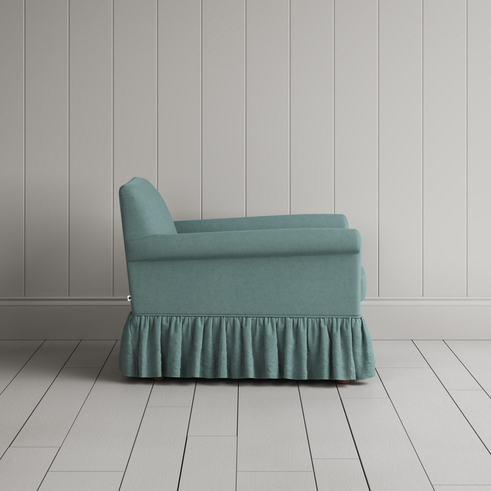 Side Profile of Curtain Call Armchair in Laidback Linen Cerulean