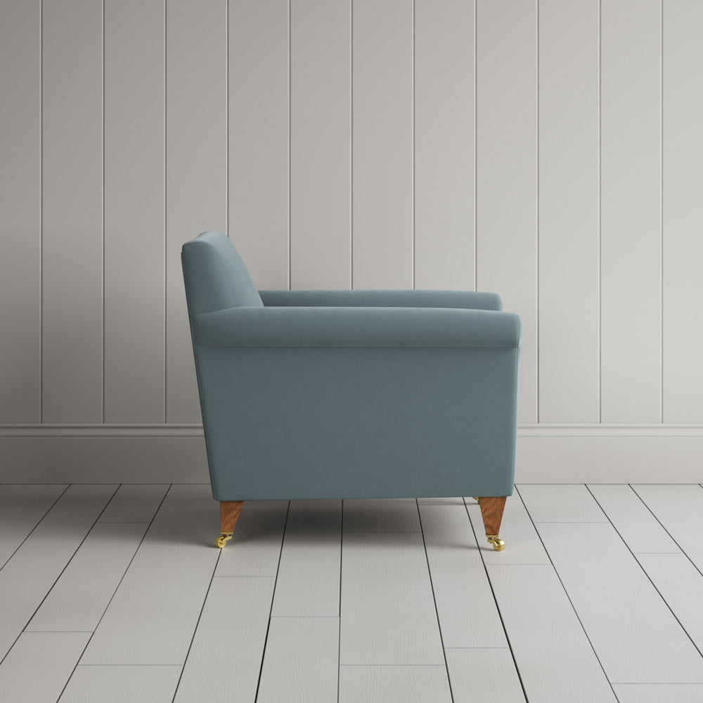  Side view of Idler Armchair in Intelligent Velvet Mineral 