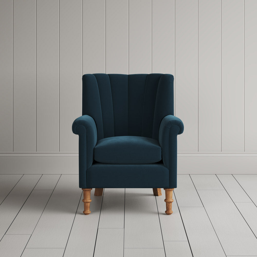 Time Out Armchair fluted back design in intelligent velvet aegean, front view by Nicola Harding.