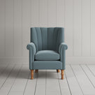 NiX furniture mineral velvet armchair with high fluted back, front studio shot.