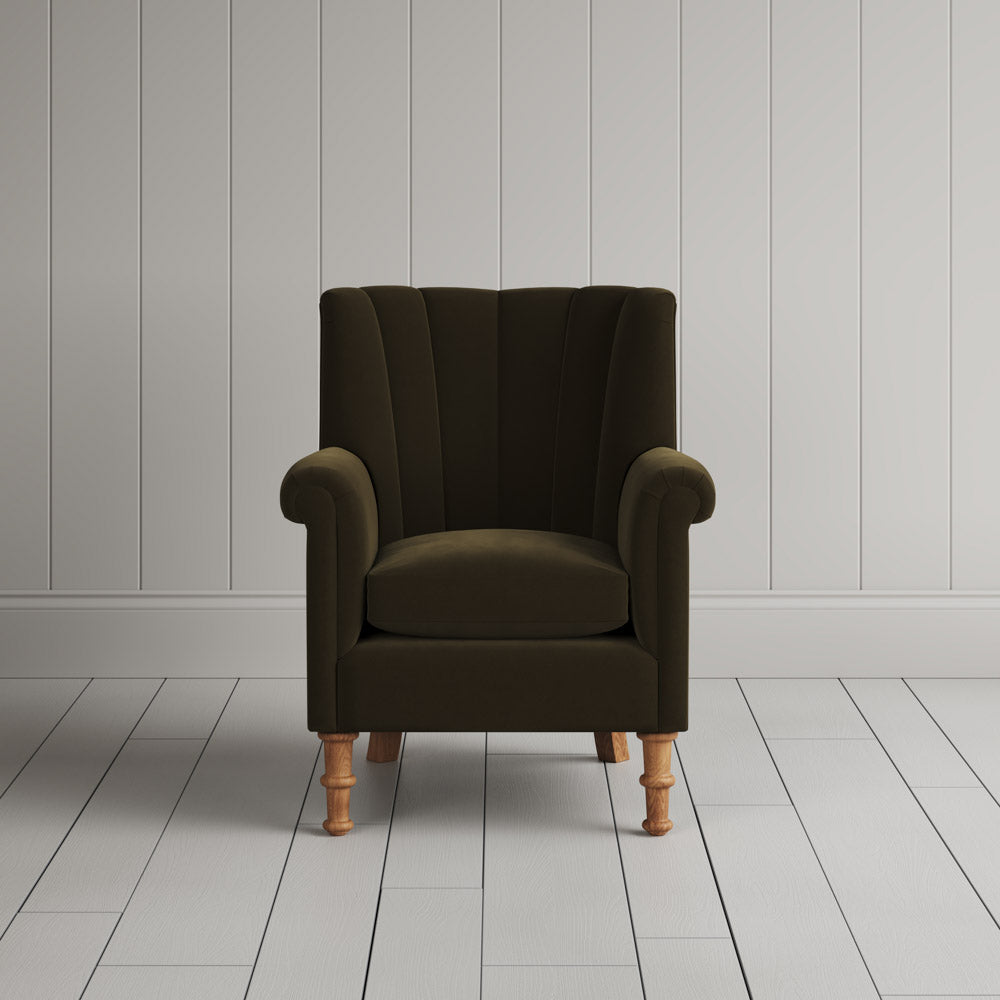 Time Out Armchair fluted back design in intelligent velvet seaweed, front view by Nicola Harding.