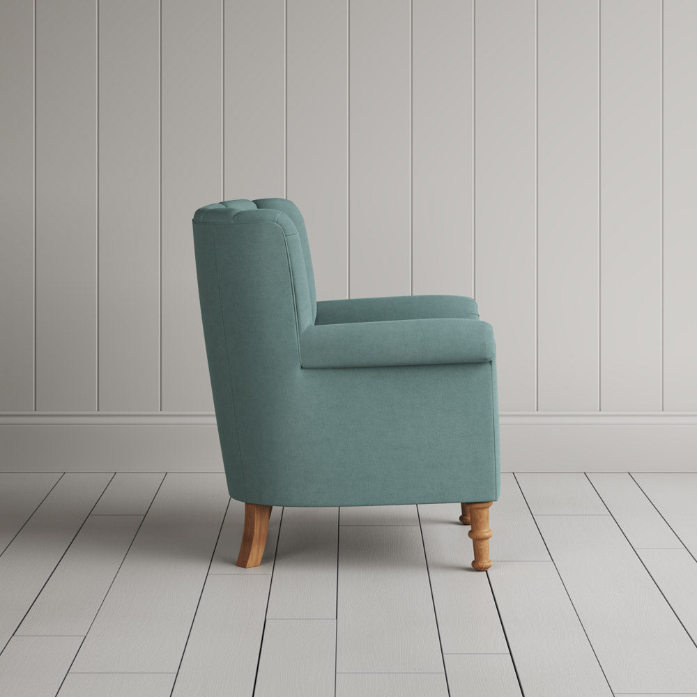 Time Out Armchair close-up detail of the turned timber front legs by NiX.
