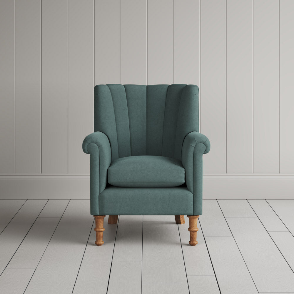 Time Out Armchair fluted back design in laidback linen mineral, front view by Nicola Harding.