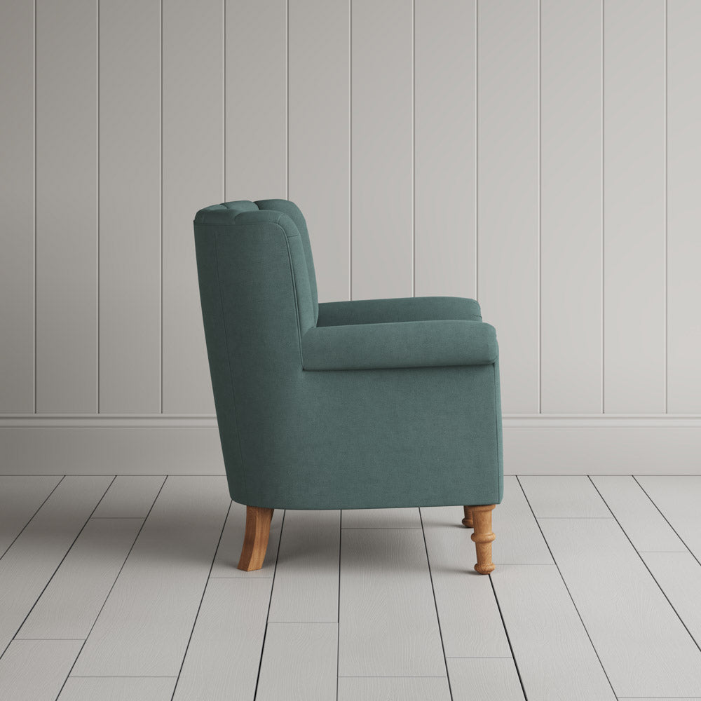  Time Out Armchair in laidback linen mineral, side view by NiX. 