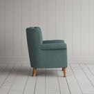 Time Out Armchair in laidback linen mineral, side view by NiX.