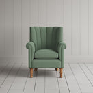 Time Out Armchair fluted back design in laidback linen moss, front view by Nicola Harding.