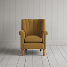 Time Out Armchair fluted back design in laidback linen ochre, front view by Nicola Harding.