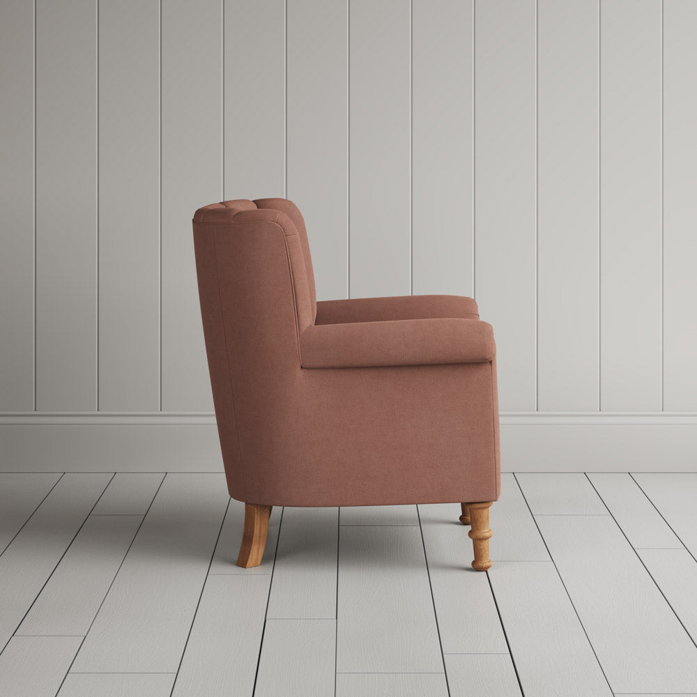  Time Out Armchair in laidback linen roseberry, side view by NiX. 