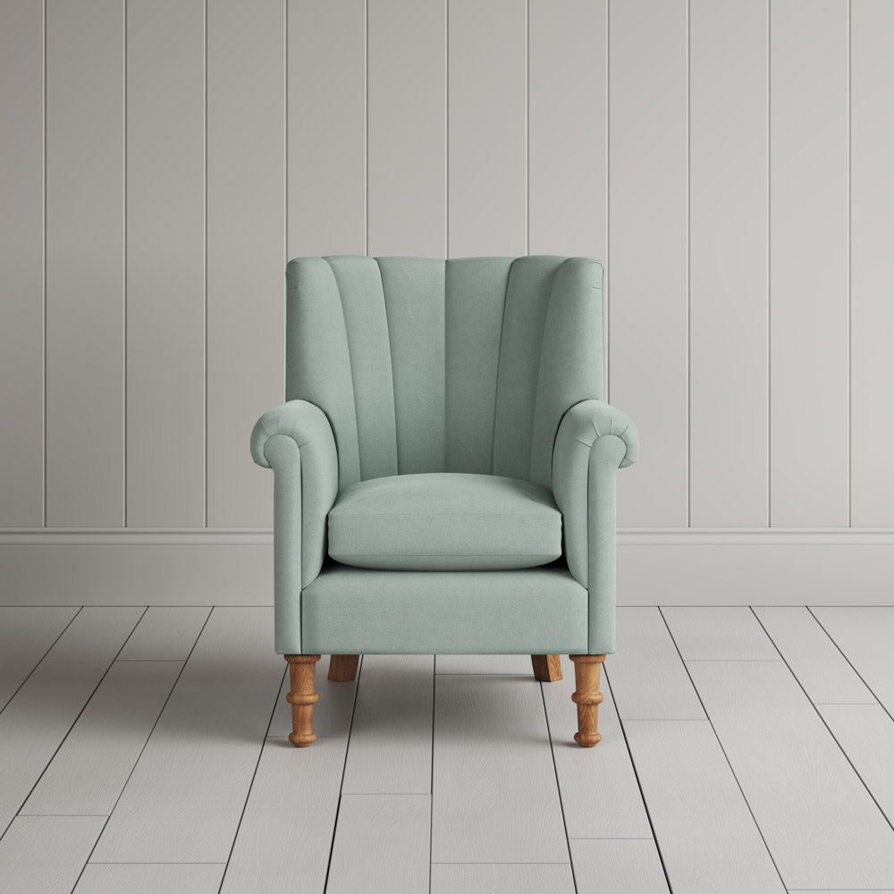  Time Out Armchair fluted back design in laidback linen sky, front view by Nicola Harding. 