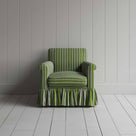Elegant green and white striped armchair featuring a charming ruffled skirt, ideal for a stylish home decor.
