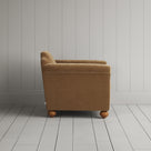 Side profile of the Stone Beige corduroy Dolittle armchair