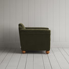 Side profile of the Caper green corduroy Dolittle armchair