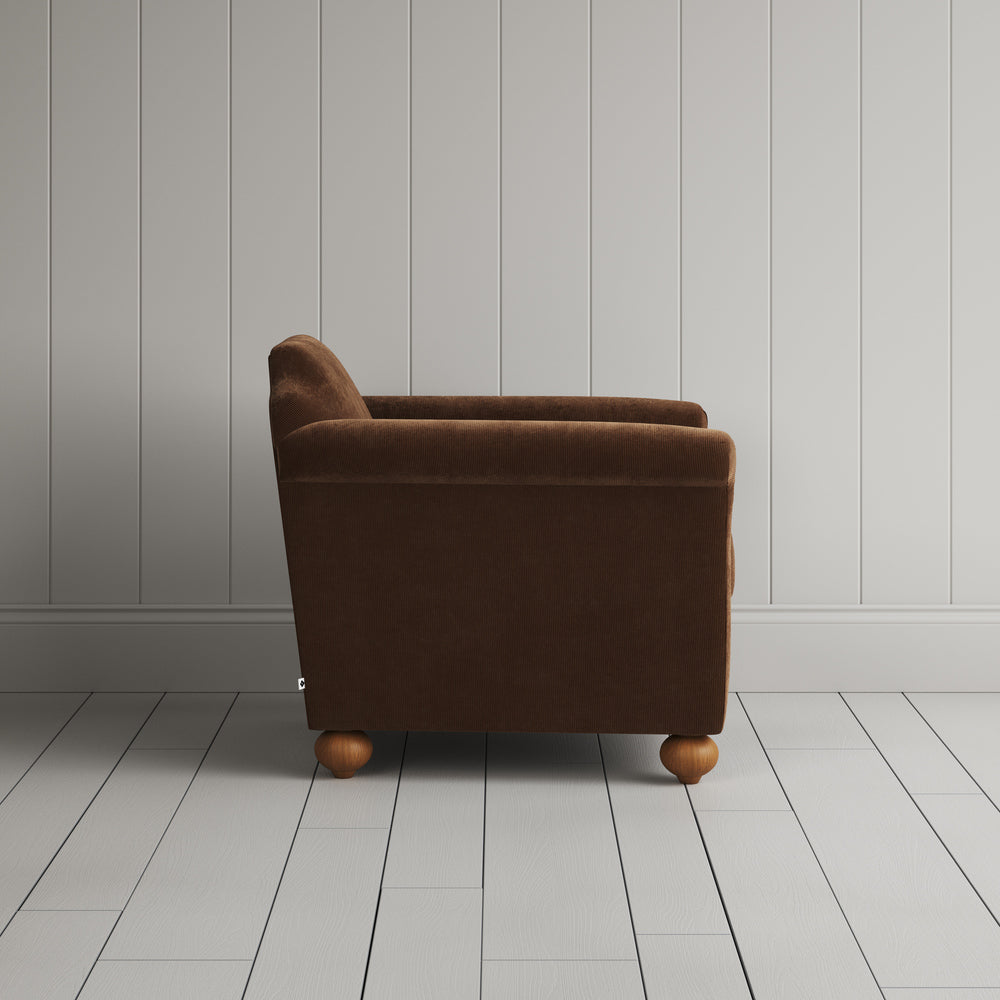 Side profile of the Tobacco corduroy Dolittle armchair