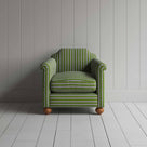 Green and white striped sofa in a spacious room with minimalistic decor.