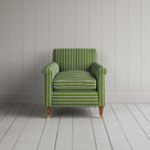 A green and white striped couch against a wall.