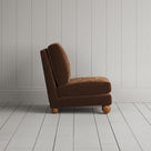 Side silhouette of the Perch slipper chair in Tobacco corduroy, perfect for awkward tight spots.