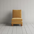 Front view of the Perch armchair in Wheat corduroy, a bespoke chair perfect for a reading nook.