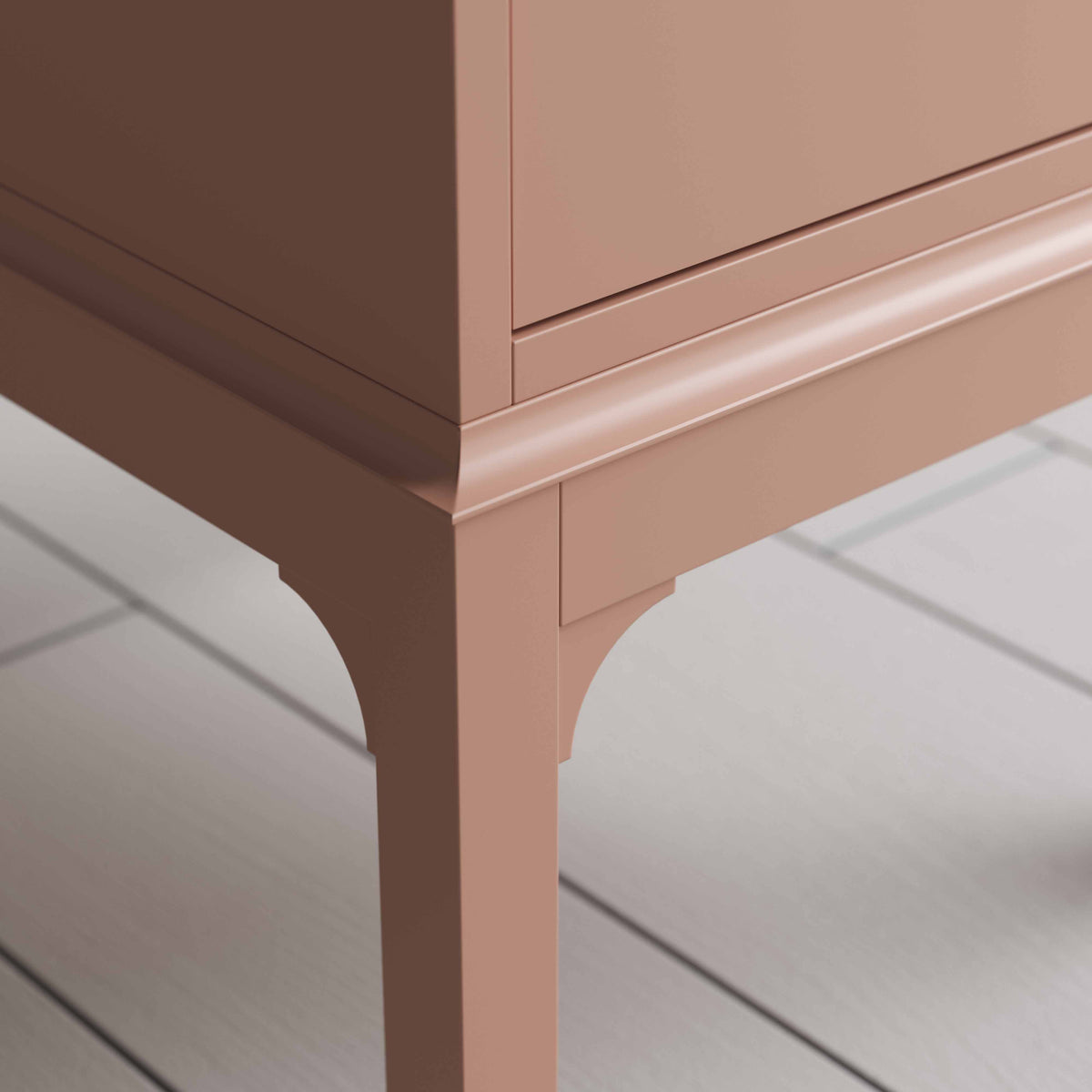 Leg Design close up of small pink bedside table with a side door, perfect for storing items 
