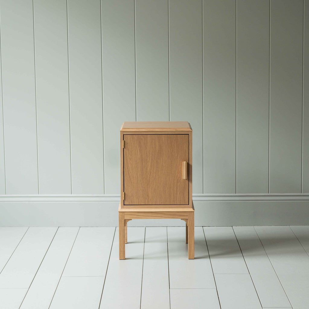  Front View of Bits and Bobs Bedside Table, Natural Oak, Left Hand Side - Nicola Harding 