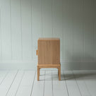 Side View of Bits and Bobs Bedside Table, Natural Oak, Left Hand Side - Nicola Harding