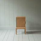 Front View of Bits and Bobs Bedside Table, Natural Oak, Left Hand Side - Nicola Harding
