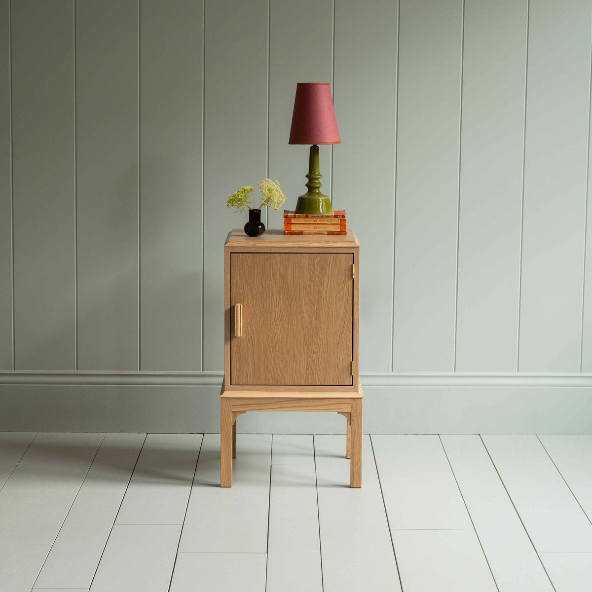 Bits and Bobs Bedside Table, Natural Oak, Right Hand Side Decorated with table lamp and a small flower bottle - Nicola Harding
