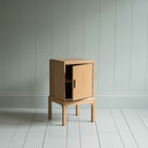 Bits and Bobs Bedside Table, Natural Oak, Right Hand Side With open storage container door - Nicola Harding