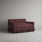 Three-quarter view of the Laidback Linen Damson Curtain Call love seat by NiX.