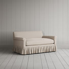 Angled shot of dove linen upholstered love seats by Nicola Harding.