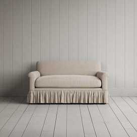 Front portrait of the Laidback Linen Curtain Call love seat by Nicola Harding interiors.