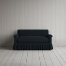 Front portrait of the Laidback Linen Curtain Call love seat by Nicola Harding interiors.
