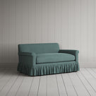 Angled shot of the Laidback Linen Mineral Curtain Call love seat by NiX.