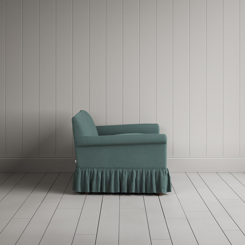  Side view showing the relaxed frame of the Curtain Call NiX interiors sofa. 