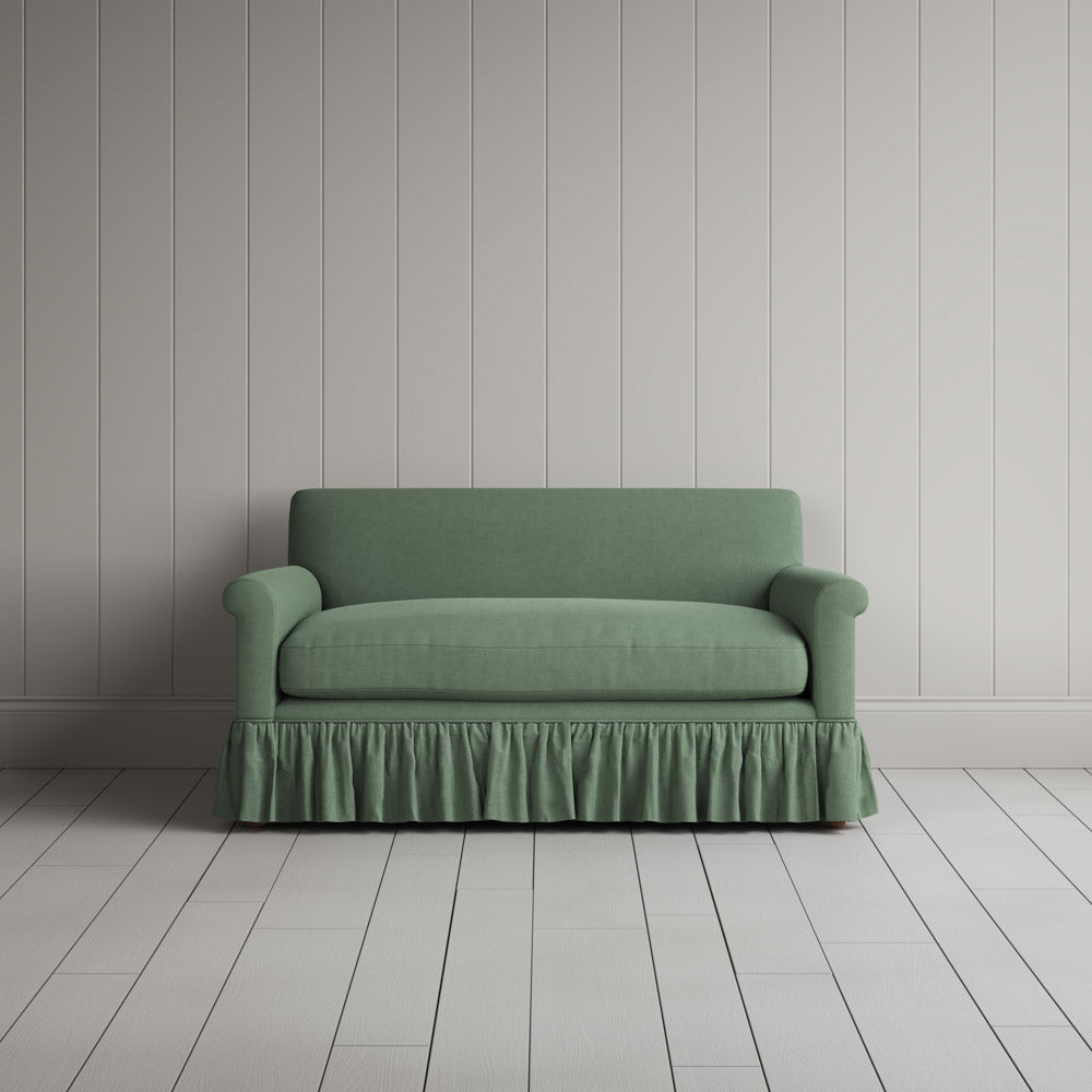  Front portrait of the Laidback Linen Curtain Call love seat by Nicola Harding interiors. 