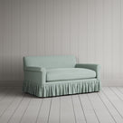 Three-quarter view of the Laidback Linen Sky Curtain Call love seat by NiX.