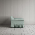 Compact side profile of a luxury sky blue linen love seat by Nicola Harding.
