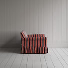Compact side profile of a luxury flame colored cotton love seat by Nicola Harding.