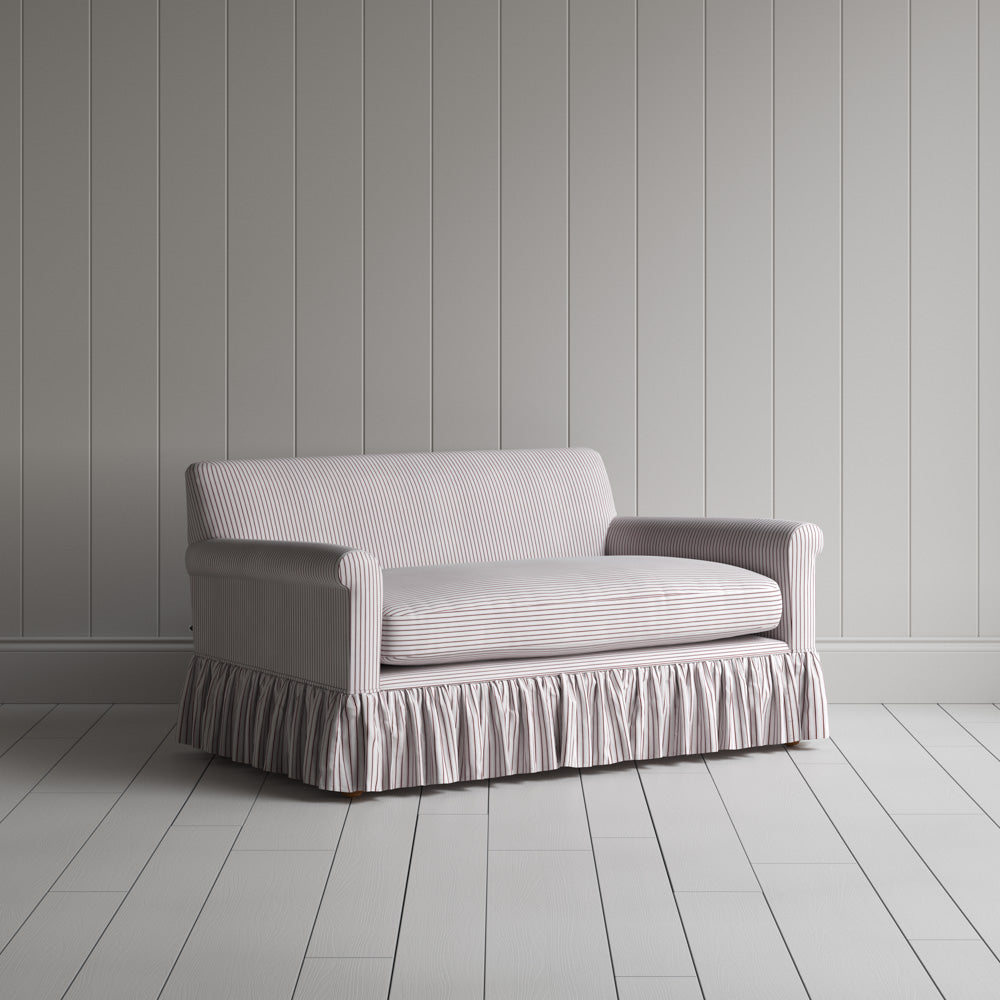  Angled shot of a berry red striped curtain call love seats by Nicola Harding. 