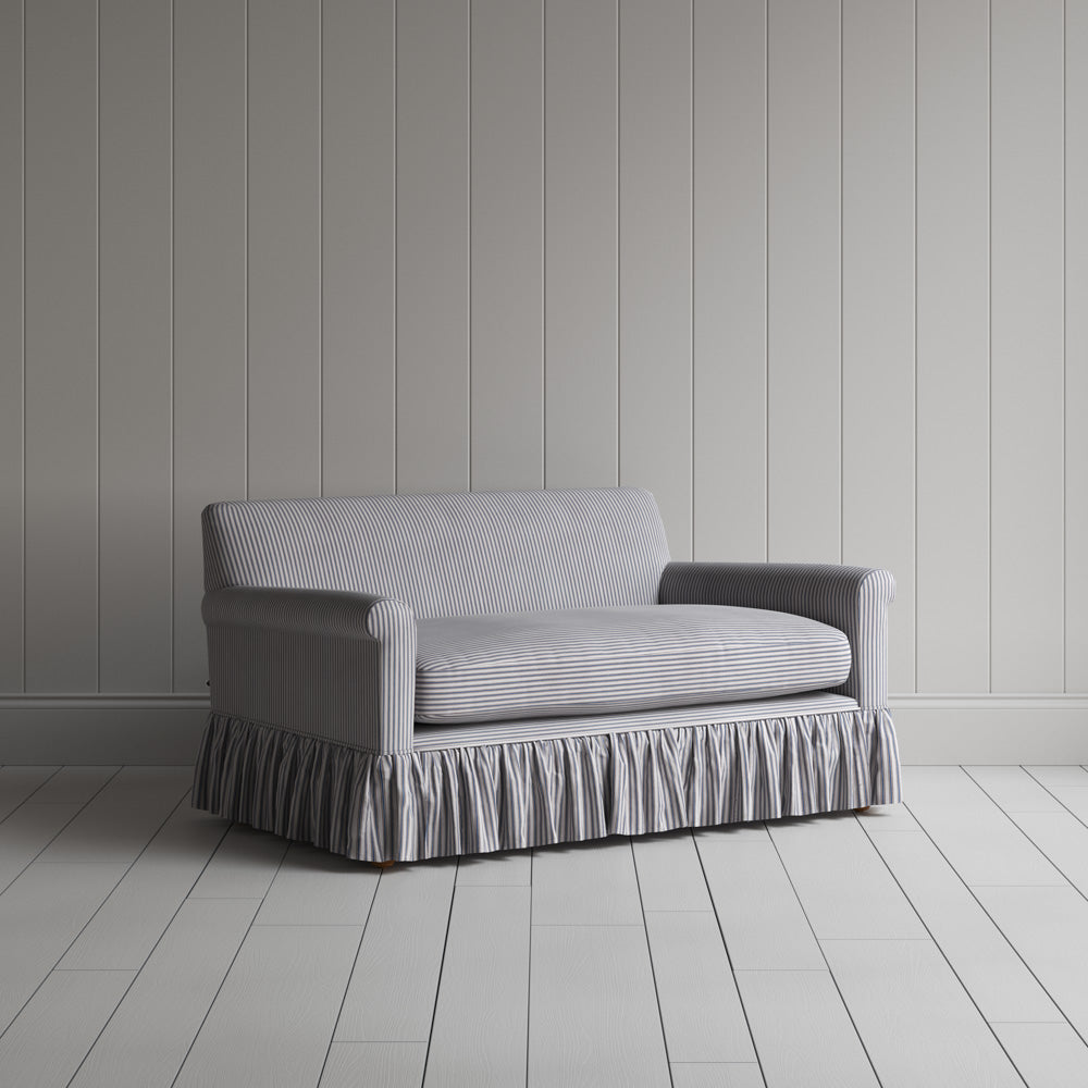 Angled shot of a blue and brown striped curtain call love seats by Nicola Harding. 