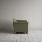 Side view showing the arched back profile of the NiX interiors Dolittle sofa.