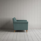 Profile view of the handcrafted Mineral linen love seat by Nicola Harding.