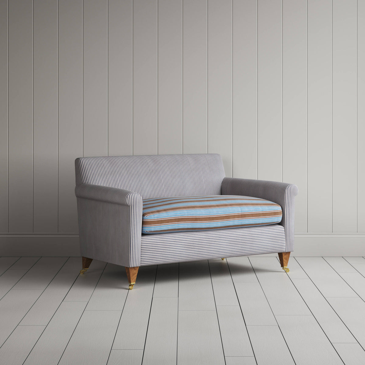 Angled view of the Ticking Blue Brown Idler love seat by NiX