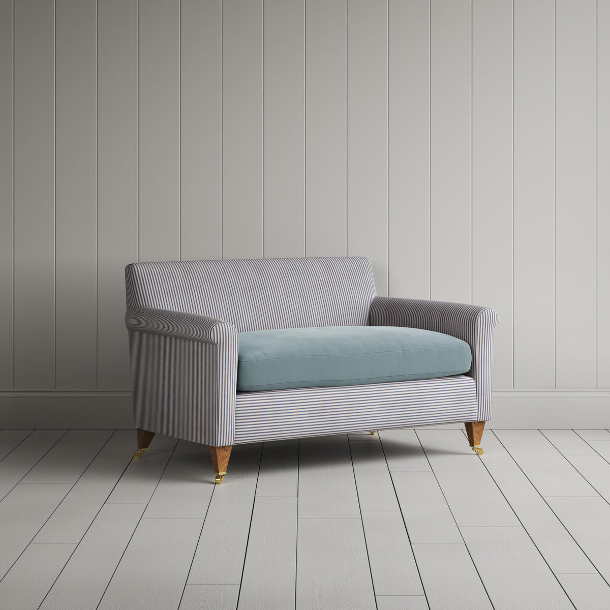 Angled view of the Ticking Blue Brown Idler love seat by NiX