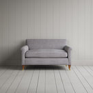 Symmetrical view of the ticking stripe Idler love seat featuring handmade British craftsmanship and refined upholstery by Nicola Harding.