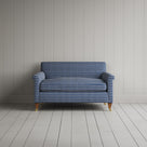 Front view of the Idler love seat in blue and brown plaid cotton with an Edwardian silhouette.