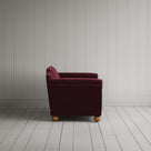 Side profile of the Cherry red corduroy Dolittle love seat