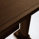 Shelf edge design of a smoky stained oak console table, highlighting the smooth finish and craftsmanship.