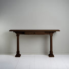 Console Table with a drawer in smoky stained oak, placed against the wall.